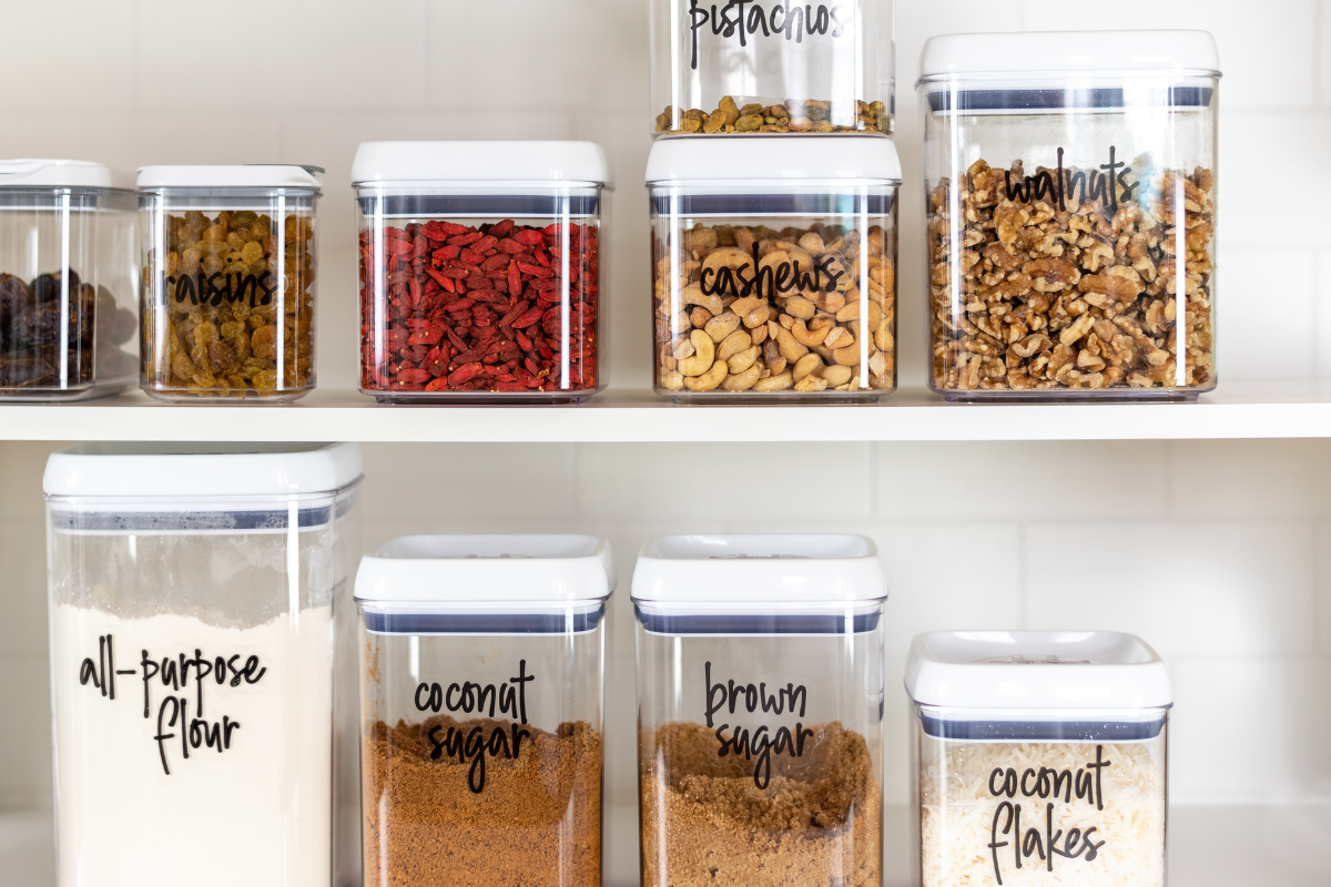 Labeled airtight pantry containers organized by category for clear visibility and easier everyday use.