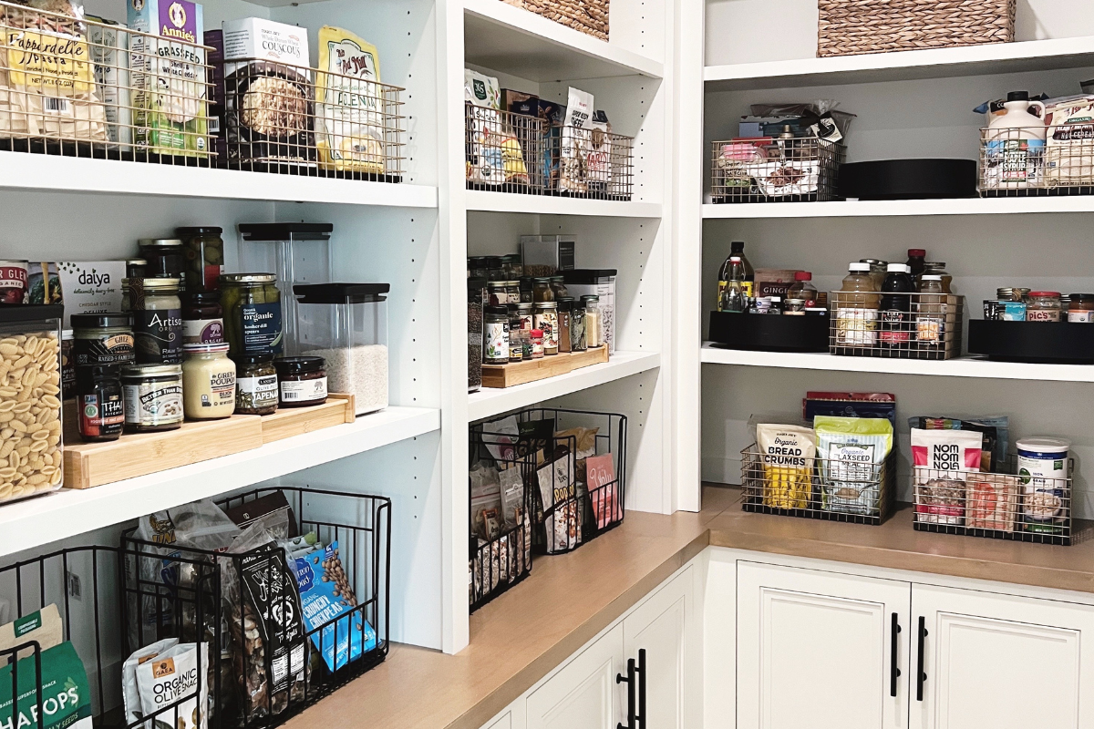 Organized pantry in a Manhattan Beach home with baskets and clear containers arranged around everyday family routines.