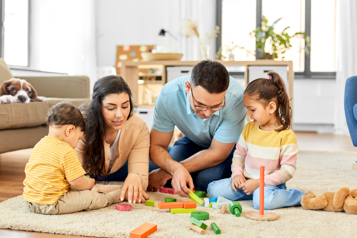 Family spending time together in a living room designed to support everyday routines with children and pets.