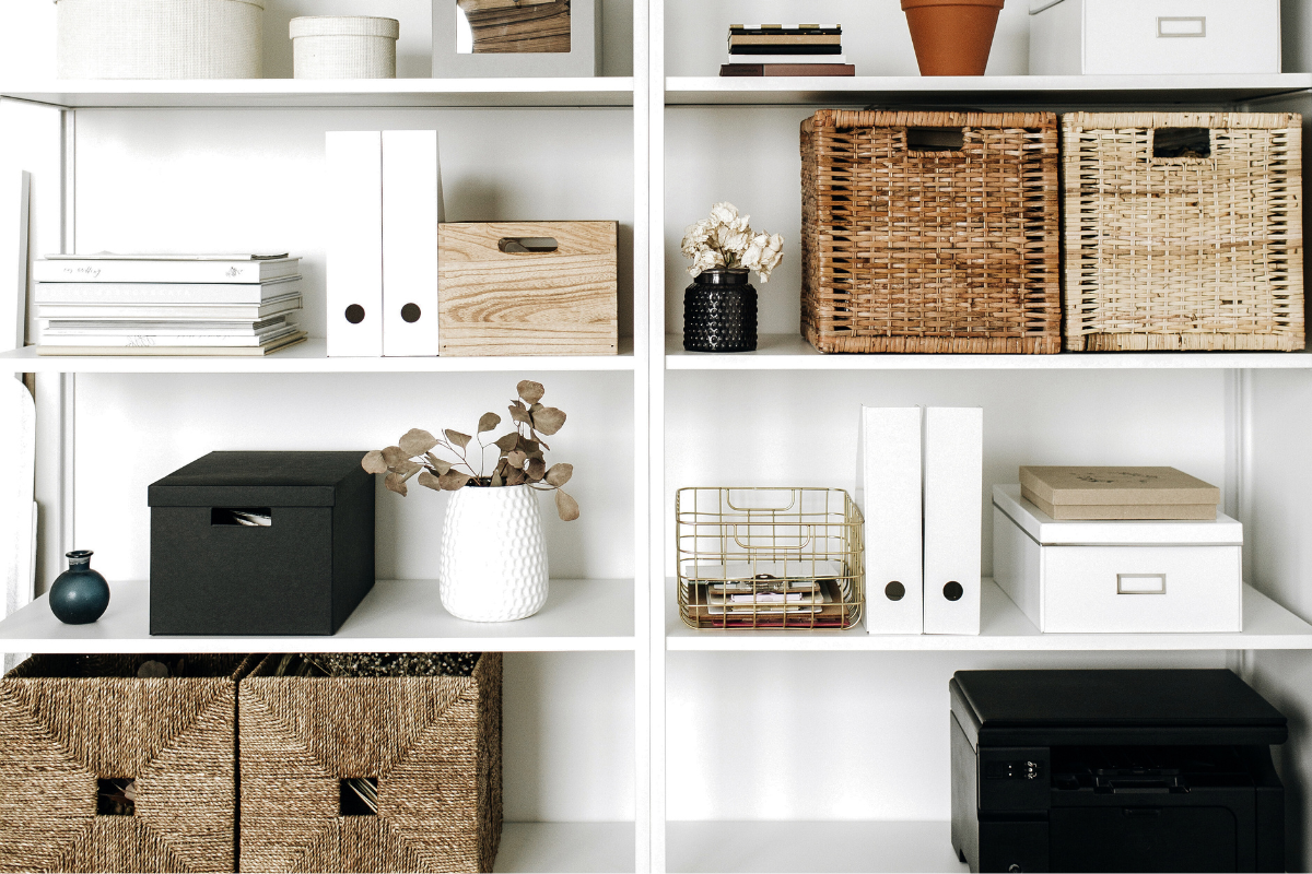 Home office shelving with baskets and designated storage for supplies, papers, and less frequently used work essentials.
