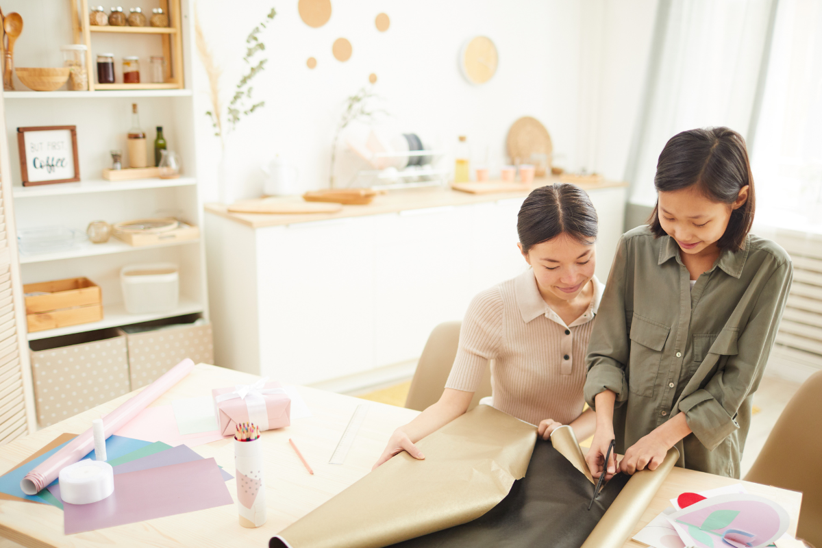 Designated gift wrap station with wrapping supplies organized together for easy access.