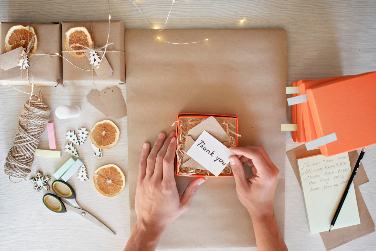 Gift wrapping table with paper, ribbon, and supplies arranged for an easy wrapping routine.
